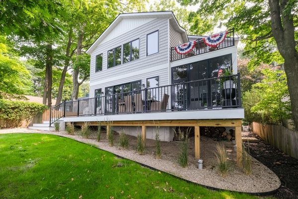 Lakefront living in Holland Michigan at its finest.  Private staircase (80 stairs) down the dune to pristine lake Michigan beach. Sleeps 15.